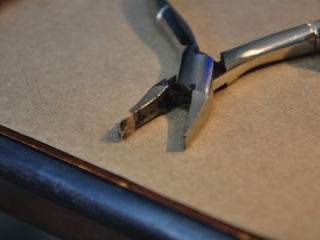 Pliers used for bending flute keys.